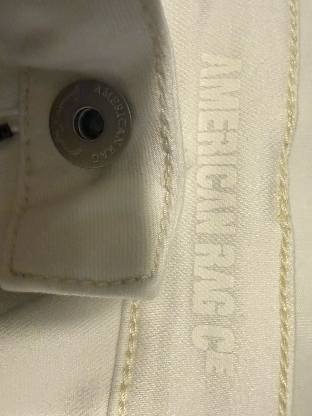 American Rag Silver Button Detail on White Fabric